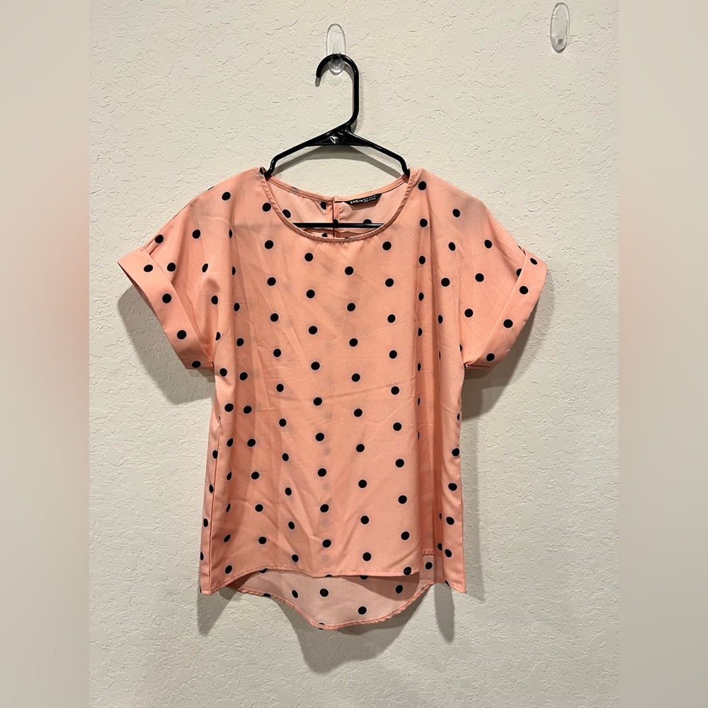 Pink shirt with black polka dots